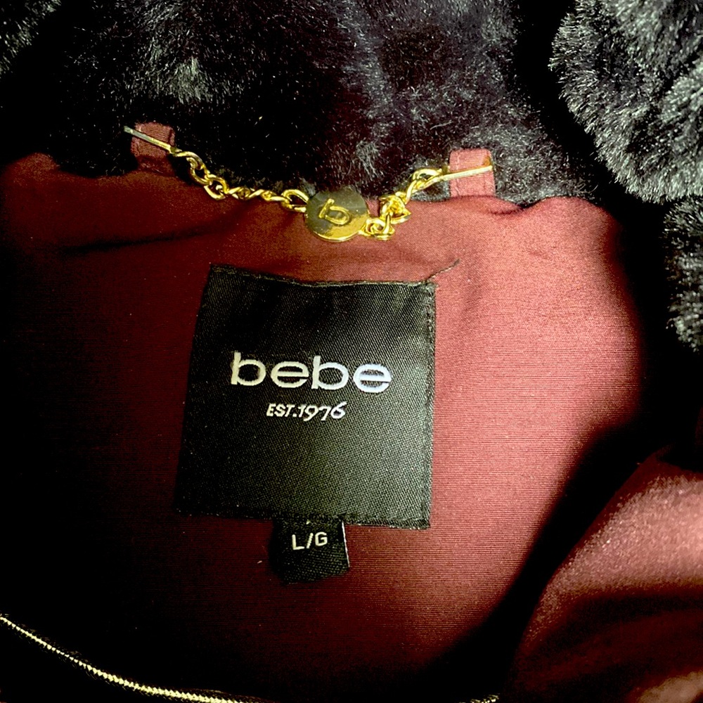 Brand: Bebe Colour: burgundy, black, with gold accents. Size: Large.